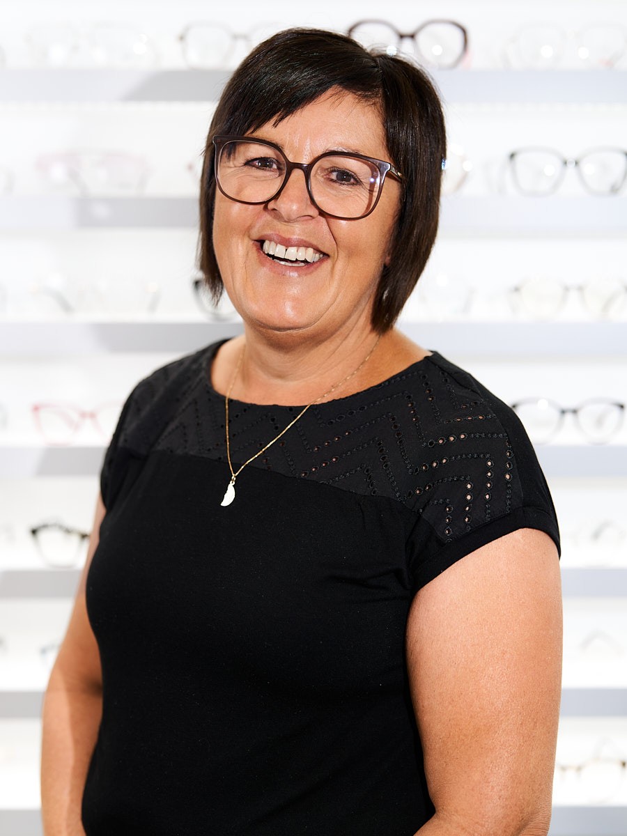 Cleaning professional and valued team member helping create a clean and welcoming atmosphere in the optical store.